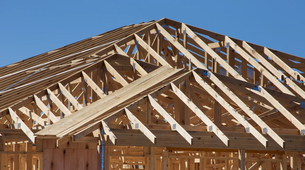 Timber wall and roof framing on a house under construction