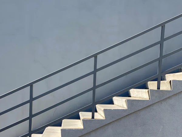 Black steel balustrade on concrete stairs